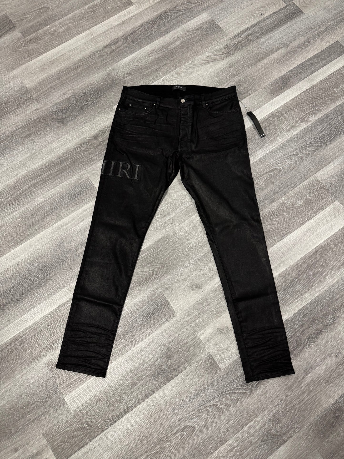 Amiri Black Serif Logo Wax Denim Jeans