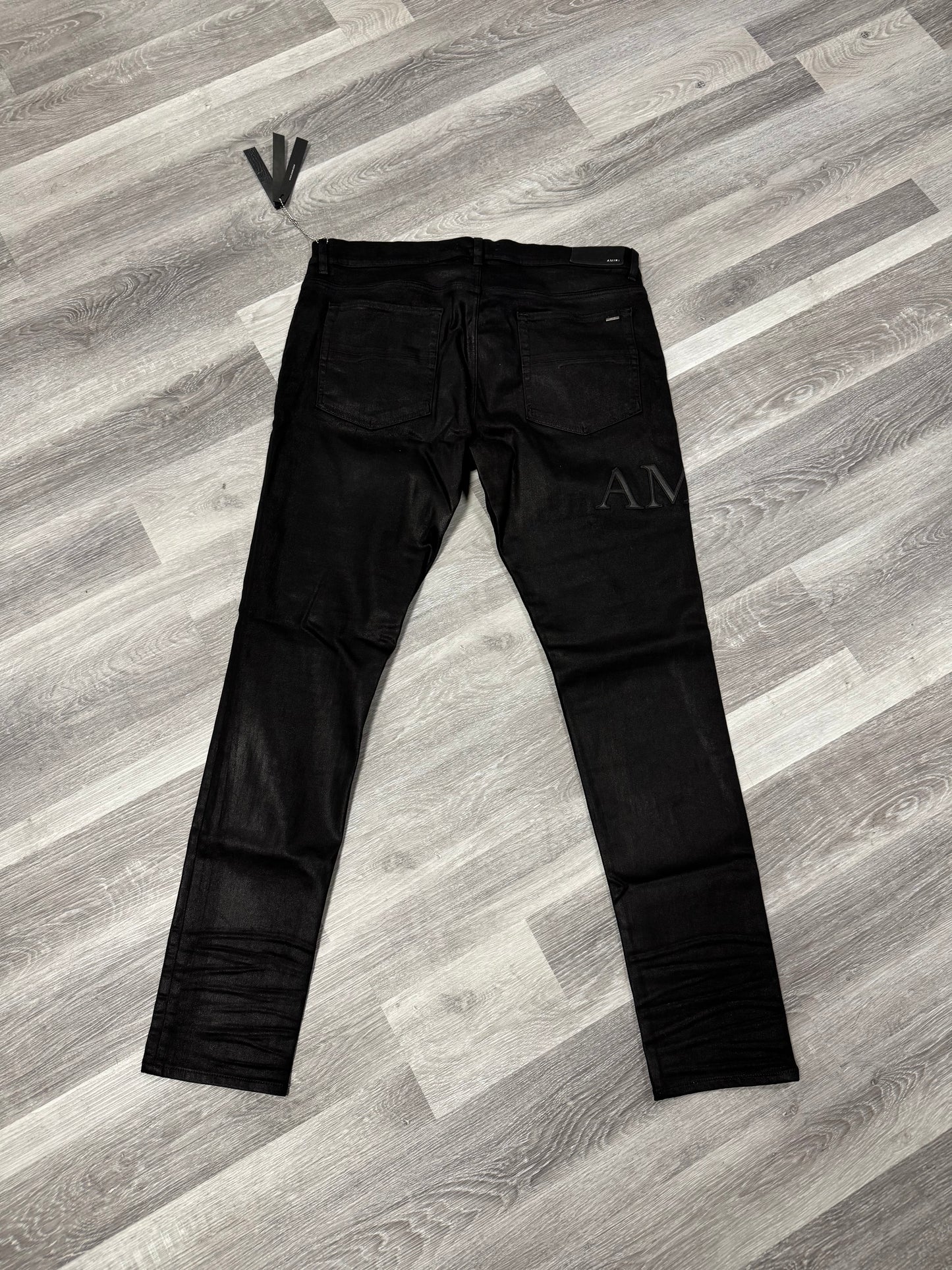Amiri Black Serif Logo Wax Denim Jeans