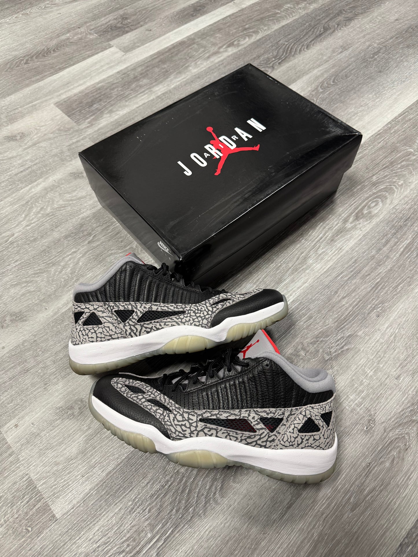 Jordan 11 Low IE Black Cement / Preowned