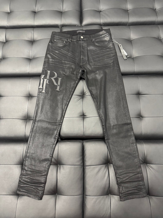 Amiri Black Wax Staggered Logo Denim Jeans